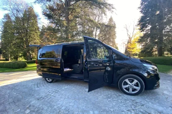 Black van with passenger and side doors open