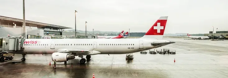 A Swiss airline plane parked on the tarmac